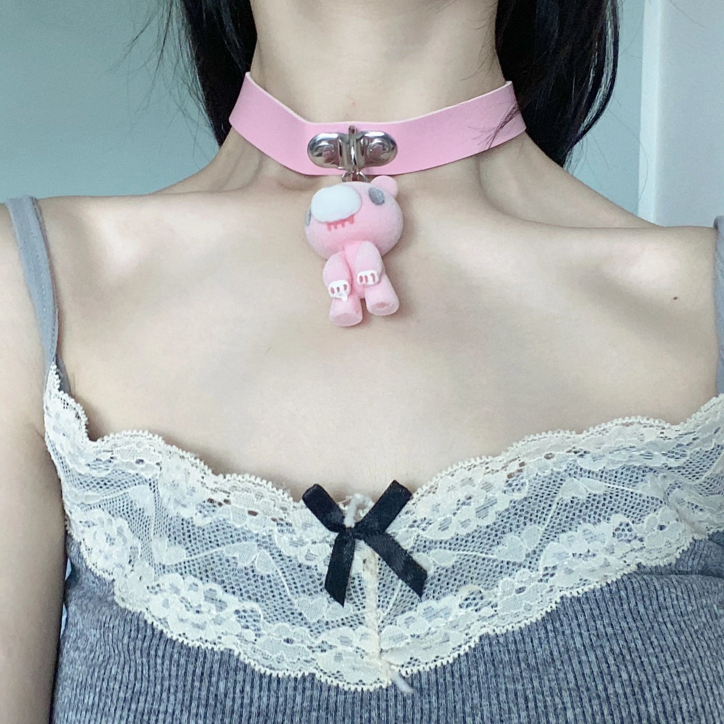 This pink choker features a cute Gloomy Bear pendant. The soft leather strap and adorable design add a sweet, edgy vibe.